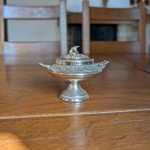 Vintage metal incense burner bowl with lid ornate floral engraving and side handles for spiritual rituals or altar decoration