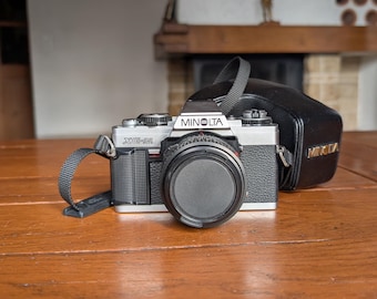 Minolta XG-M vintage film camera with MD 50mm f/2 manual focus lens from Japan for collector display, analog photography or studio decor