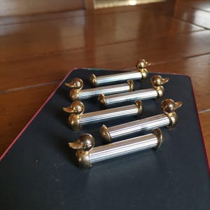 Vintage metal knife rests set of 6 with duck head design NOS for elegant table setting or cutlery presentation