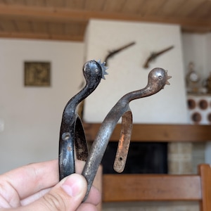 Vintage pair of metal riding spurs with rowels for equestrian gear collectors