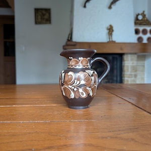 Hungarian vintage handmade ceramic pitcher from Hódmezővásárhely with brown and white floral motif