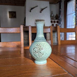 Celadon vintage Korean ceramic vase with inlaid handmade openwork pattern and floral design for traditional Asian art collection