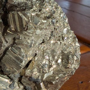Raw Pyrite cat gold natural mineral very shiny in rock with cubic crystals for mineral collection and interior decoration