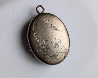 Antique Victorian silver oval locket for two photos with engraved bird and flowers