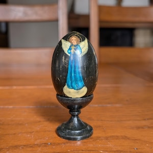 Vintage wood Easter egg with hand-painted angel in blue vestment and inscription IV (Jesus is Risen) in Orthodox tradition from Russia