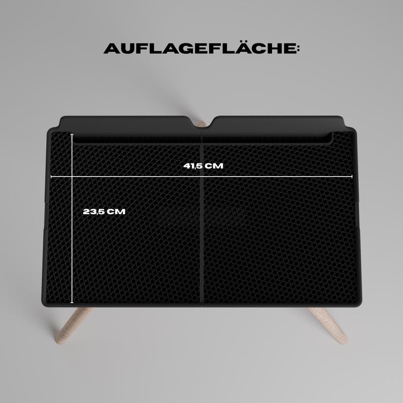 Peut inclure: Un plateau rectangulaire noir avec une surface textur&eacute;e en nid d'abeille et des pieds en bois clair. Le texte AUFLAGEFL&Auml;CHE est visible au-dessus du plateau, avec des lignes de mesure indiquant une largeur de 41,5 cm et une profondeur de 23,5 cm.
