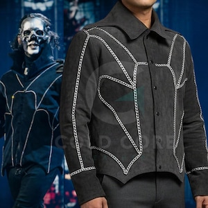 May include: Dark grey jacket with white chain-like stitching details. The jacket has a collared neckline and button-up front. The design features a unique pattern of chain-like accents, creating a striking visual effect. The jacket is part of a costume or cosplay ensemble.