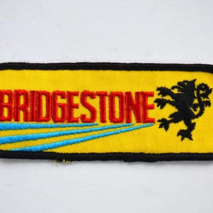 Vintage Bridgestone gesticktes Gelb-Blau-Schwarz-Motorrad-Applikations-Patch