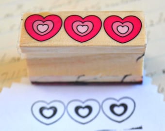 Op hout gemonteerde rubberen stempel harten