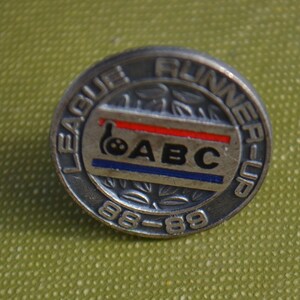 May include: Silver pin with a bowling ball and the text "League Runner-Up 88-89" and "ABC" in red, white, and blue.