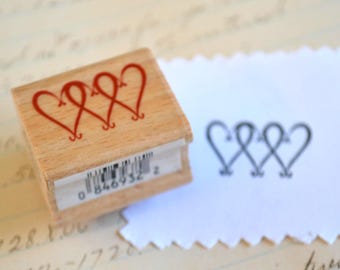 Op hout gemonteerde rubberen stempel harten