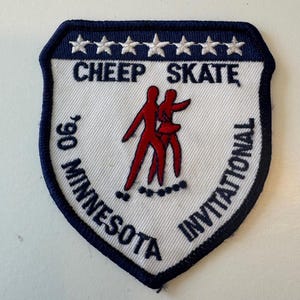 May include: White patch with blue border and five white stars. The text "CHEEP SKATE" is in blue. The text "90 MINNESOTA INVITATIONAL" is in blue and wraps around the edge of the patch. A red silhouette of two people skating is in the center.