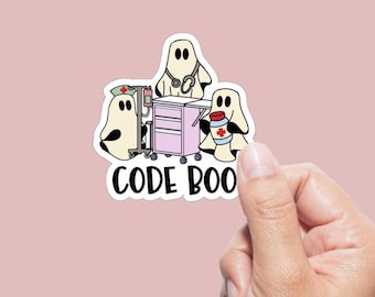 May include: A sticker featuring three cartoon ghosts in medical attire. One ghost wears a nurse's cap and stands near a medical cart. Another ghost has a stethoscope, and the third holds a container with a medical cross. The text "CODE BOO" is below.