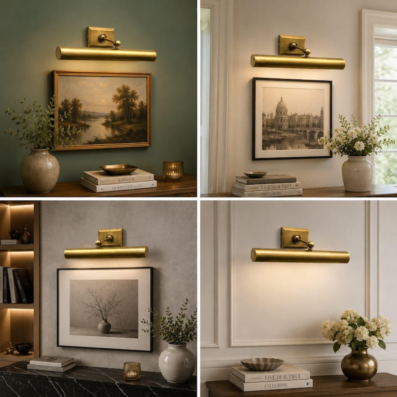 May include: A brass picture light fixture with a cylindrical lamp head and a rectangular wall mount. The light is mounted above framed artwork, casting a warm downward glow. The fixture features a metallic finish and an adjustable arm.
