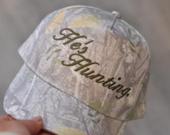 He’s Hunting Camo Trucker Cap