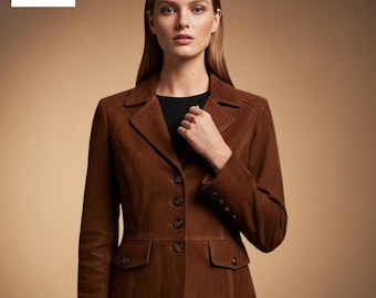 May include: A brown suede blazer with a classic design. The blazer features a notched collar, button closure, two front pockets, and buttoned cuffs. The brand name "Bluxen" is in the top left corner. The jacket is a rich, warm brown color.
