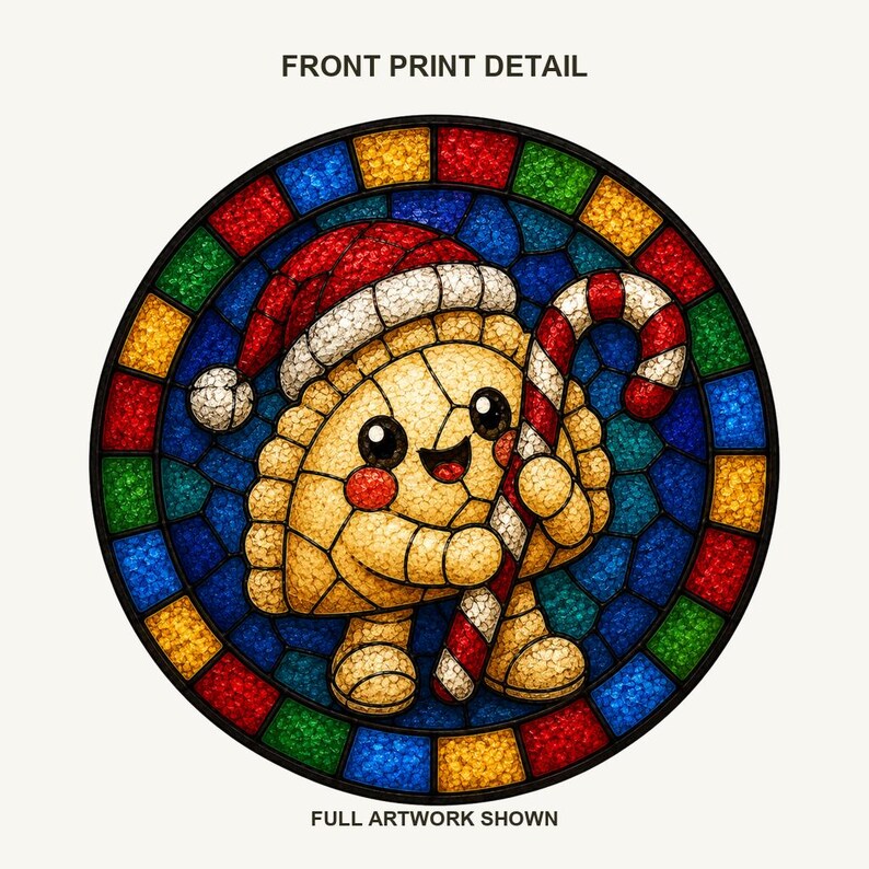 May include: A circular graphic featuring a smiling, golden-brown dumpling character wearing a red and white Santa hat and holding a red and white striped candy cane. The background is a colorful stained-glass pattern. Text reads FRONT PRINT DETAIL.