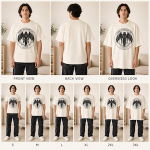 May include: An off-white short-sleeve t-shirt featuring a circular black graphic on the chest. The design depicts a winged creature with the text "POINT PLEASANT WV", "1966", and coordinates. The shirt is shown in various sizes from S to 3XL.