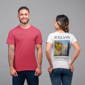 May include: Two people wearing t-shirts. One is wearing a red t-shirt with the text "Explore Ireland". The other is wearing a white t-shirt with a picture of a waterfall and the word "ICELAND".