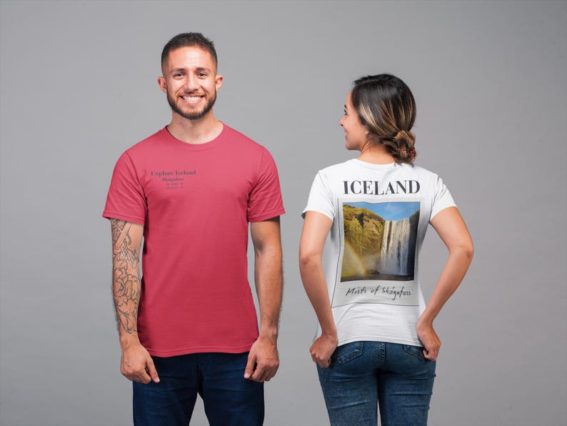 May include: Two people wearing t-shirts. One is wearing a red t-shirt with the text "Explore Ireland". The other is wearing a white t-shirt with a picture of a waterfall and the word "ICELAND".