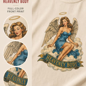 May include: A cream-colored t-shirt featuring a graphic print of an angel with wavy brown hair, large wings, and a blue dress, sitting on clouds. Below the angel is a blue banner with the text HEAVENLY BODY in gold letters. The image includes close-up circular insets.