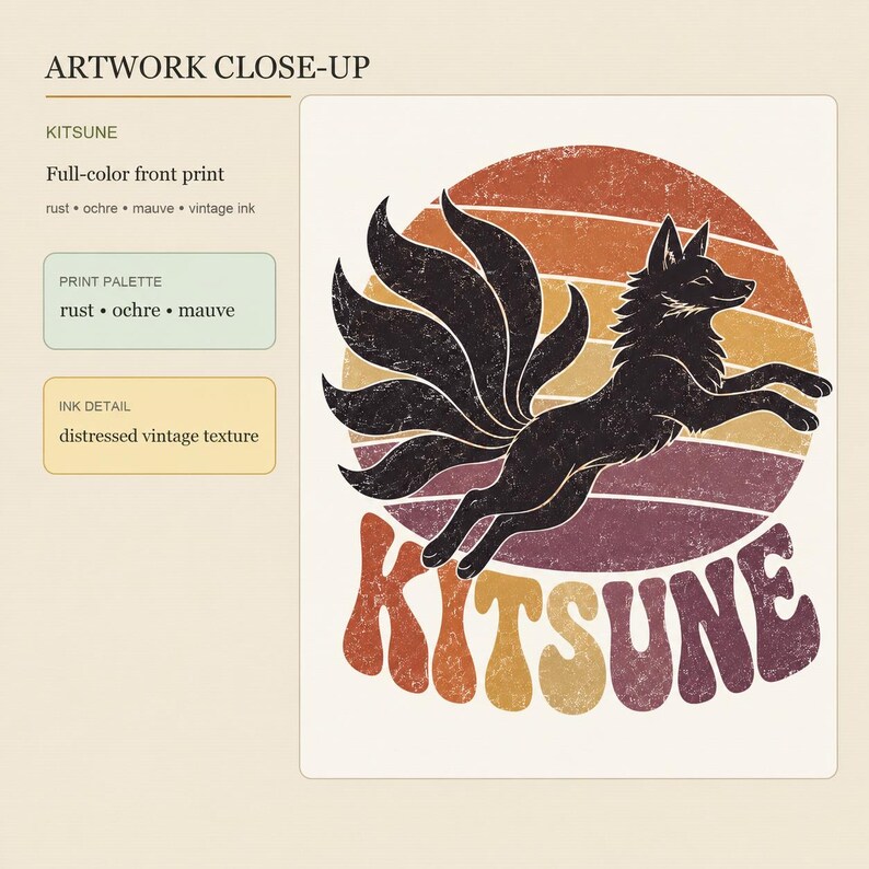 May include: A graphic print featuring a black nine-tailed fox leaping in front of a circular sunset background with horizontal stripes in rust, ochre, and mauve. The word KITSUNE is printed below in a bold, wavy font with a distressed texture.