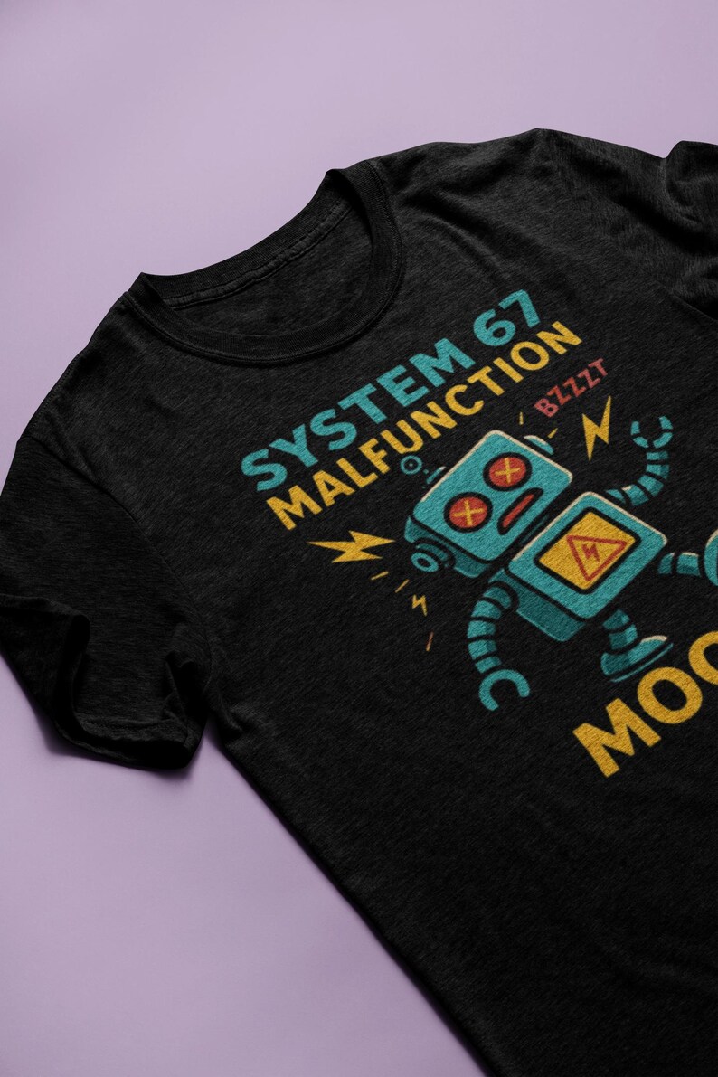 May include: Black t-shirt featuring a distressed graphic of a malfunctioning robot with the text "SYSTEM 67 MALFUNCTION" in teal and yellow. The robot is teal with red eyes and a yellow hazard symbol.