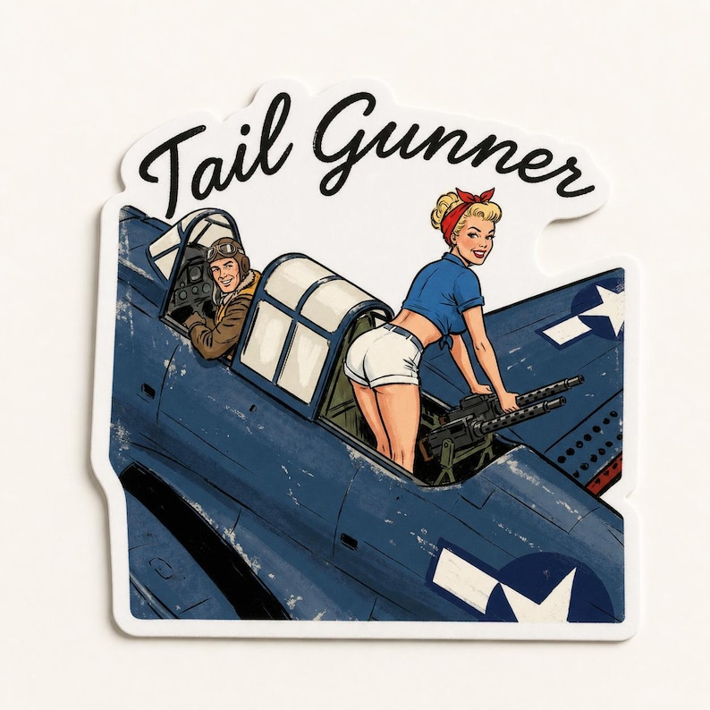 May include: A die-cut sticker featuring a vintage-style illustration of a blue military aircraft with a pilot in the cockpit and a person in a blue shirt and white shorts operating a machine gun. The text Tail Gunner is printed in black script.