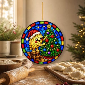 May include: A circular stained glass ornament featuring a yellow dumpling character wearing a red Santa hat, standing on a small stool to decorate a green Christmas tree with red and blue ornaments, all framed by a colourful mosaic border.