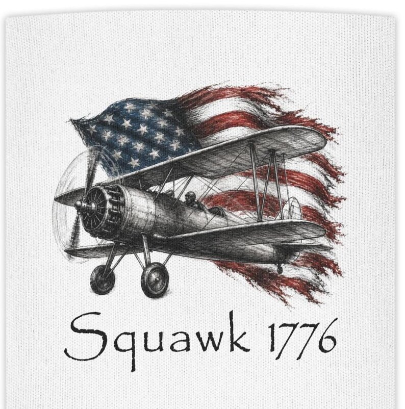 May include: A white fabric surface featuring a detailed black ink sketch of a vintage biplane flying in front of a waving American flag. The text Squawk 1776 is printed in a black serif font below the illustration of the aircraft and flag.