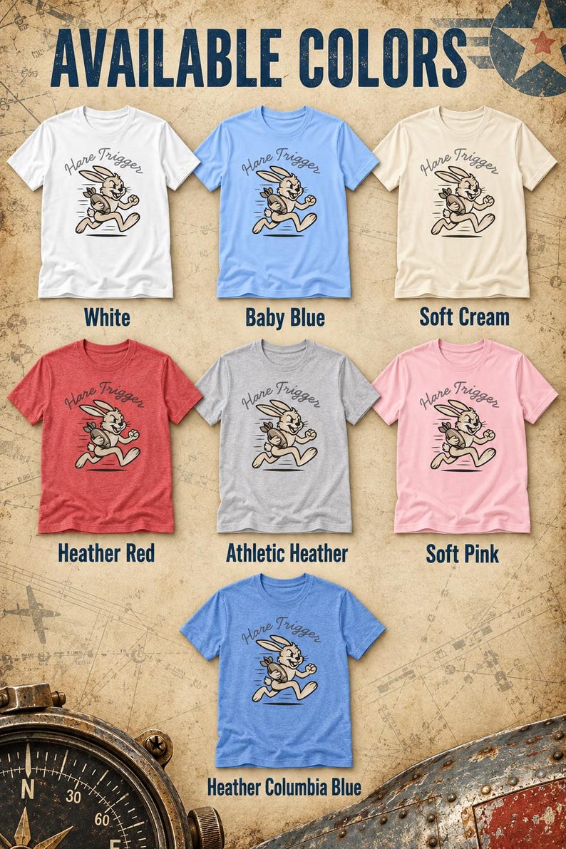Puede incluir: Una colecci&oacute;n de siete camisetas de manga corta en blanco, azul beb&eacute;, crema suave, rojo jaspeado, gris jaspeado atl&eacute;tico, rosa suave y azul columbia jaspeado. Cada camiseta presenta un conejo corriendo con una granada y el texto Hare Trigger.