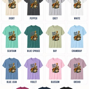 May include: A collection of Comfort Colors 1717 short-sleeve t-shirts in fifteen colors, including ivory, pepper, grey, white, seafoam, blue spruce, bay, chambray, blue jean, violet, blossom, orchid, berry, true navy, and black, each with a Pacific Pearl graphic.