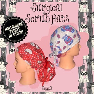 May include: Two surgical scrub hats on mannequin heads. One is red with white polka dots and Hello Kitty designs. The other is white with blue and pink donut graphics. Text reads "Surgical Scrub Hats" and "Halloween Prints In Stock!"