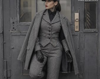 May include: A grey tweed three-piece suit consisting of a button-up vest, trousers, and a matching overcoat draped over the shoulders. The outfit includes a flat cap, a black collared shirt, and black leather gloves. The text SuitCrafters is visible.