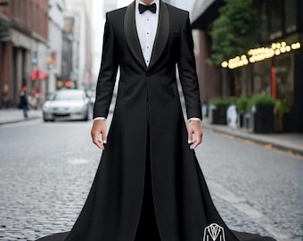 May include: A formal black tuxedo with a long coat and a black bow tie. The tuxedo has a satin lapel and a long, flowing skirt. The image is set on a city street.