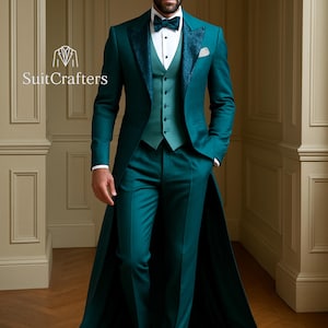 May include: A teal three-piece suit with a long coat, vest, and trousers. The suit features a patterned lapel and a white dress shirt with a bow tie. The logo "SuitCrafters" is visible on the left side of the image.