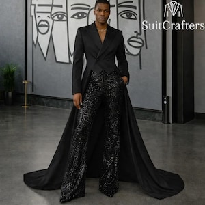 May include: A black tuxedo jacket with a long, flowing tail, paired with black sequined pants. The jacket has a double-breasted design and is worn over a black top. The image features the text "SuitCrafters".