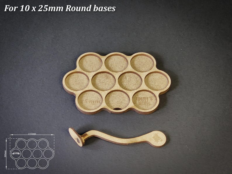 May include: A wooden tray with ten circular cutouts, each 2.5cm in diameter, and a matching handle. The tray is designed to hold round bases. The text "For 10 x 25mm Round bases" is at the top.