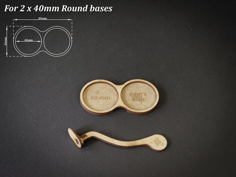 May include: Wooden round bases for miniatures, with a handle. The bases are designed for 40mm miniatures. The image also includes a diagram with measurements in millimeters. The text on the base says "Jimmy's Minis".