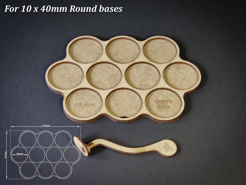 May include: A wooden base designed to hold ten 40mm round bases, with a matching handle. The base is light brown with circular cutouts and the text "For 10 x 40mm Round bases". The handle has a circular end and a curved design.