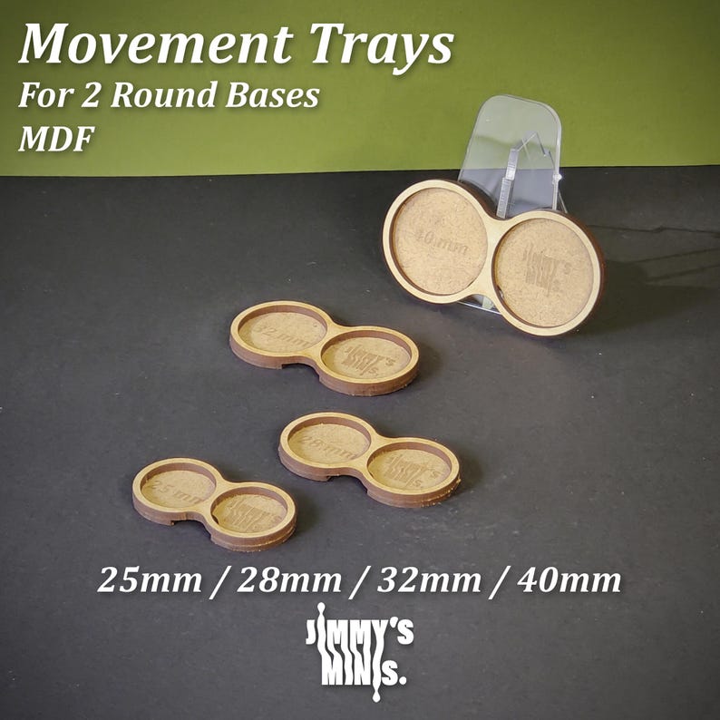 May include: MDF movement trays for two round bases. The trays are light brown with circular cutouts for 25mm, 28mm, 32mm, and 40mm bases. The text "Movement Trays" and "Jimmy's Minis" are visible.
