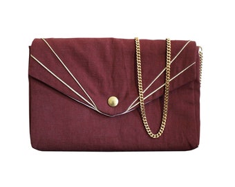 Bernadette handbag in burgundy cotton with cut-outs highlighted with gold lurex edging, gold chain handle