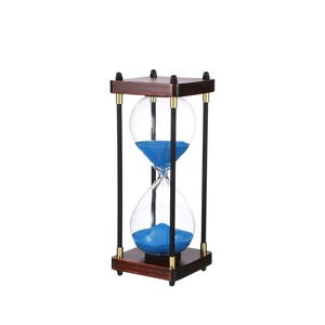 May include: An hourglass with a dark wood frame and base, featuring clear glass bulbs filled with blue sand. The hourglass is supported by black rods with gold accents, creating a classic and decorative timekeeping device.