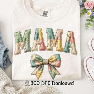 May include: A white Comfort Colors sweatshirt featuring the word "MAMA" in pastel patchwork letters. A matching patchwork bow is below the word. The image also includes the text "300 DPI Donloawd".