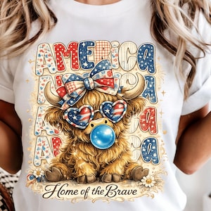 May include: A white t-shirt featuring a graphic of a fluffy Highland cow wearing a patriotic bow and heart-shaped sunglasses with a blue bubblegum bubble. The background text reads AMERICA and Home of the Brave in red, white, and blue patterns.