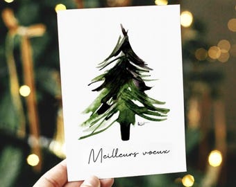 May include: A white rectangular greeting card featuring a watercolor illustration of a green pine tree with dark brushstrokes. Below the tree, the text "Meilleurs voeux" is printed in a black cursive font. The card has a clean, simple design.