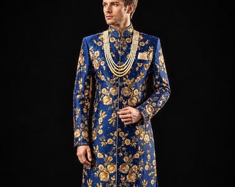 May include: A formal, long-sleeved, navy blue embroidered coat with gold floral patterns, paired with matching blue pants and gold shoes. A pearl necklace and pocket square complete the ensemble. The outfit is suitable for special occasions.
