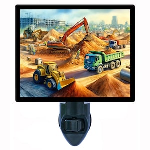 May include: A night light featuring a colorful illustration of a construction site with a yellow bulldozer, a green dump truck, and a red excavator. The scene is set against a backdrop of a city skyline and a pile of dirt.