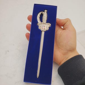 vintage silvertone sword letter opener made in France - French Sword Letter Opener . Nice detailing. Very Good Condition.