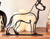 Matte black Great Dane continuous line sculpture on wooden shelf with warm candles, unique gift for Great Dane parents home decor